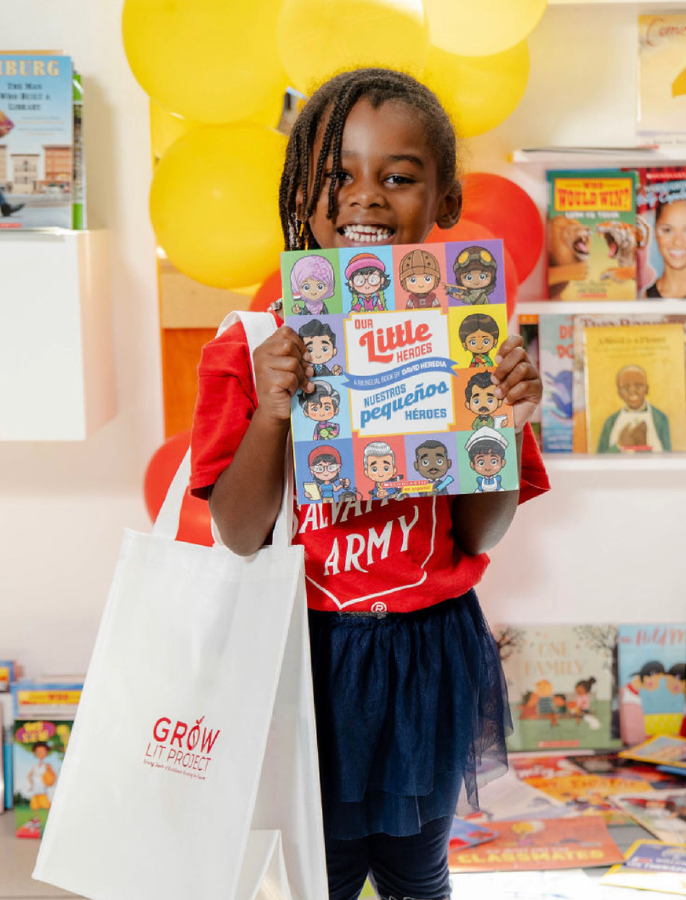 happy-kid-holding-a-bookk-Growlit