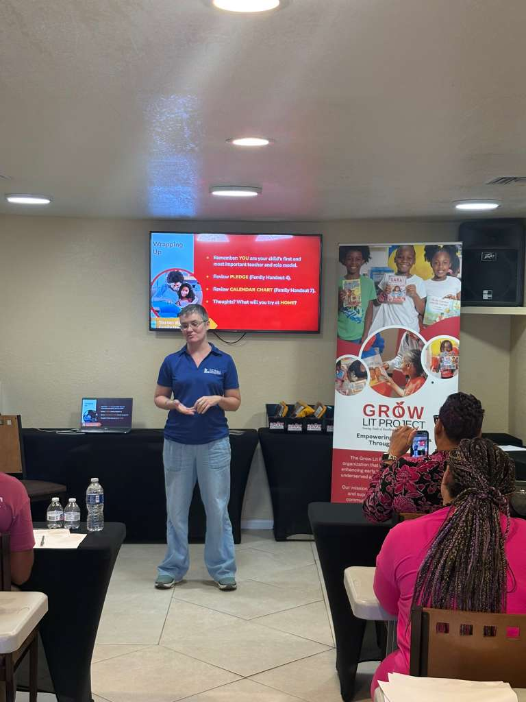 Workshop facilitator presenting practical literacy strategies to families.